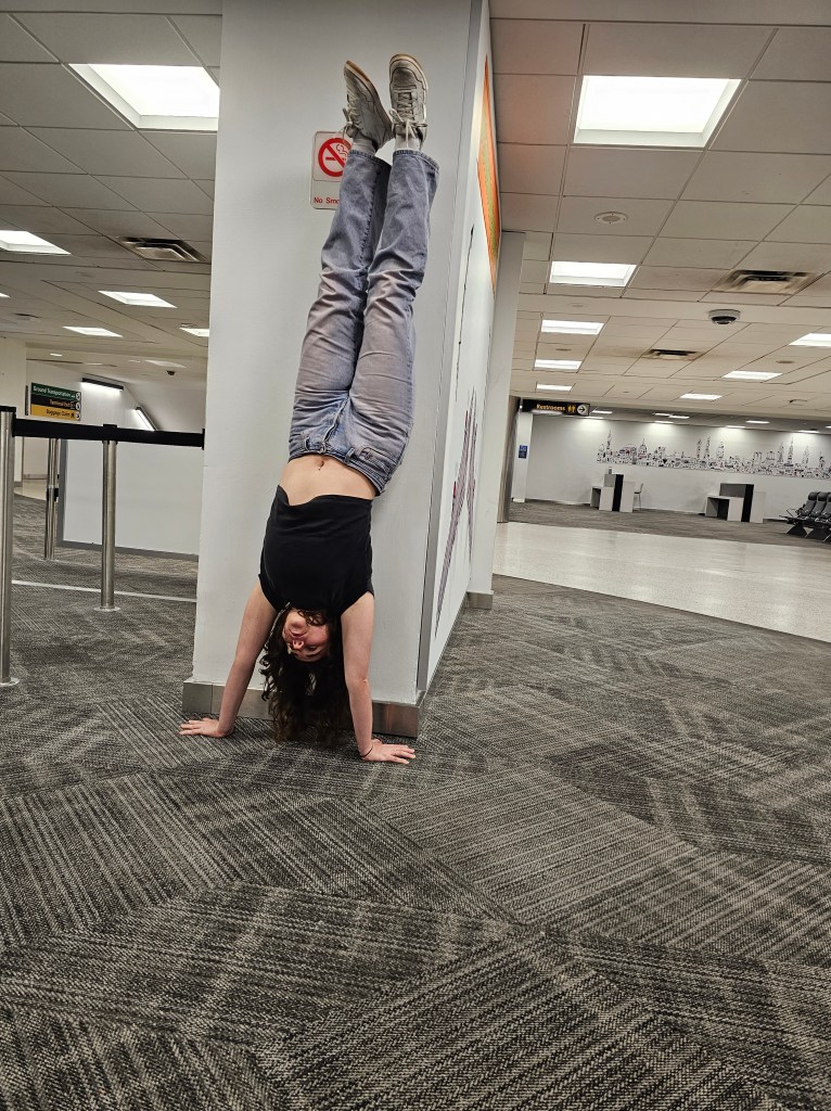 Marina doing a handstand at JFK